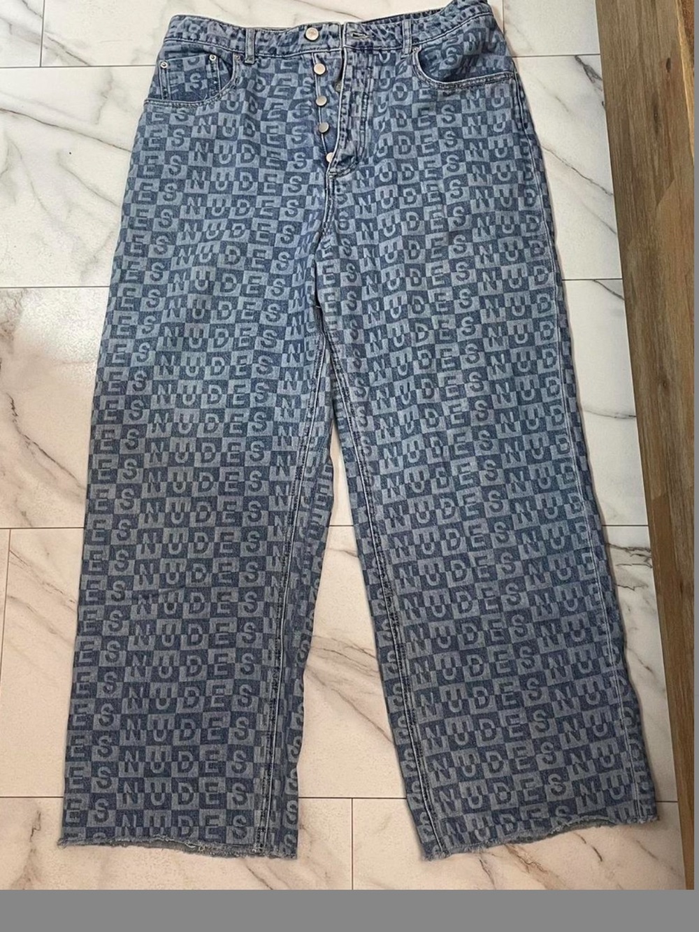 All-Over Logo Denim Jeans in Faded Blue